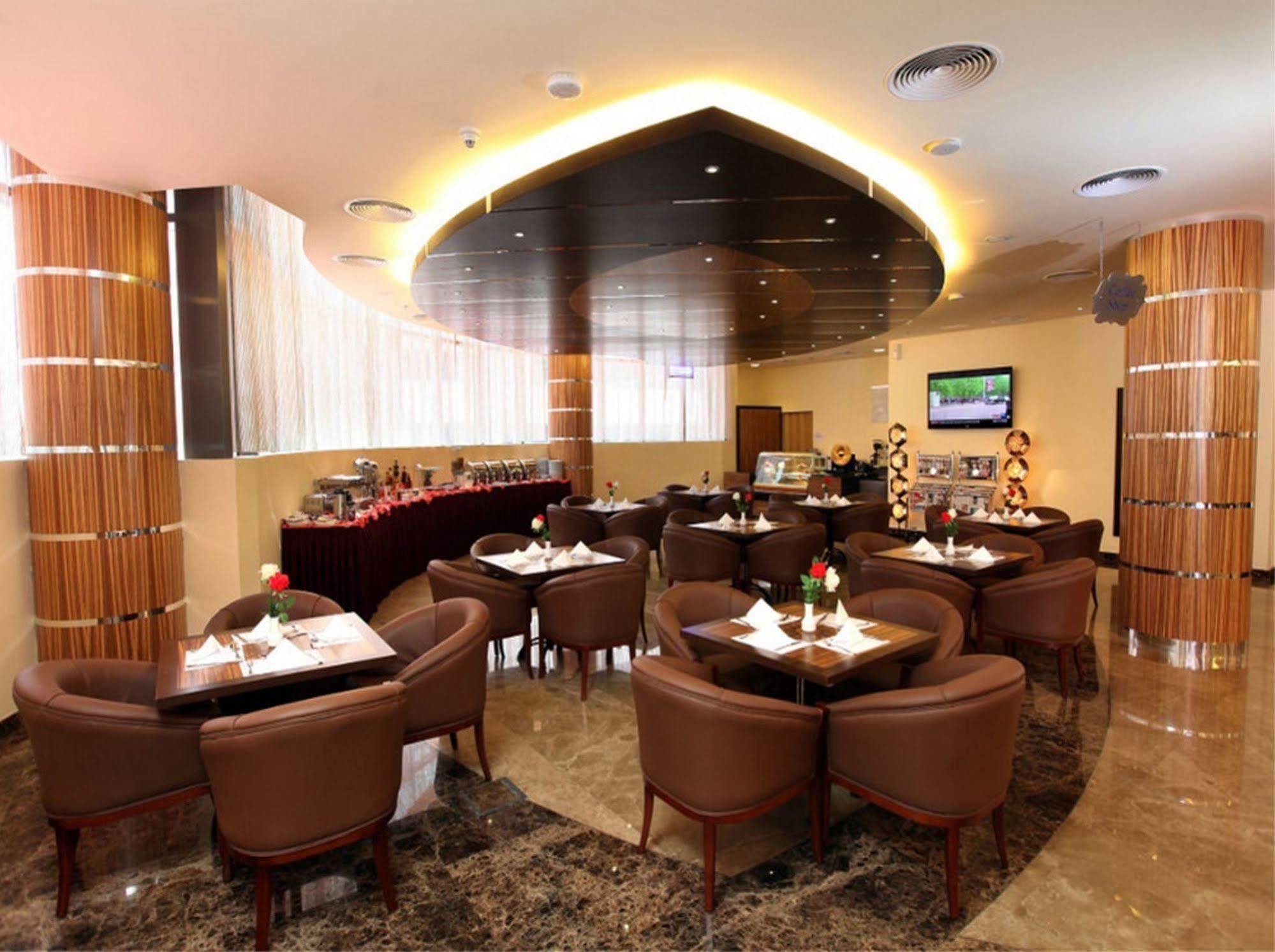 Xclusive Maples Hotel Apartment Dubai Restoran fotoğraf